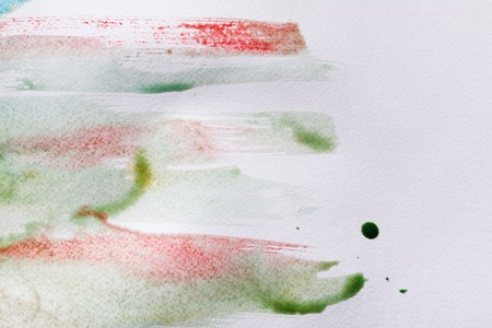 Minimalistic abstract watercolor textured background. Hand painted brush strokes on white paper, top view, copy spaceの写真素材