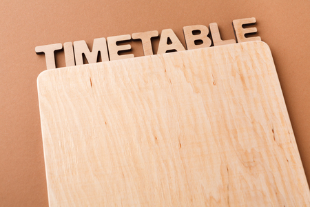 Timetable with blank wooden board, copy space. Time management, work optimization supplyの写真素材