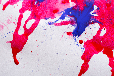 Hand painted watercolor background. Splashes of red and blue paint on paper texture. Modern art backdrop with copy space, top viewの写真素材