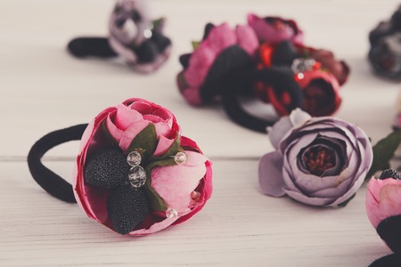 Variety of hair rubbers decorated with flowers. Beautiful handmade scrunchies assortment, female decoration, beauty conceptの写真素材