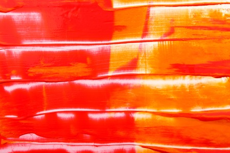 Abstract background with mixed red and yellow oil-paints. Handpainted strokes and lines texture on...
