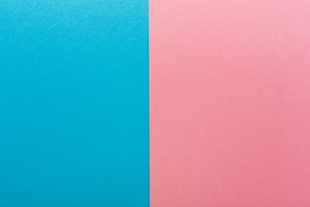 Blue and pink contrast background, copy space. Sex differences, baby gender conceptの写真素材
