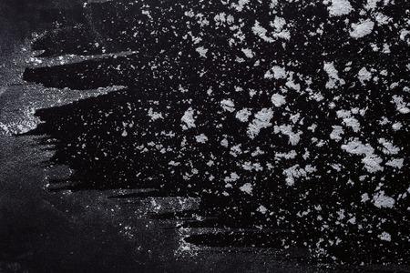 Abstract background. Wheat flour on black. Top view on blackboard. Baking concept, cooking dough or pastry.の写真素材