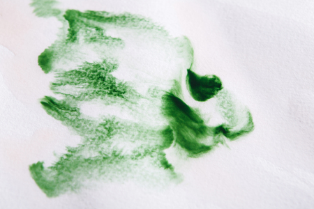 Abstract watercolor background. Expressive brush strokes of green aquarelle on paper texture. Modern art backdrop with copy spaceの写真素材