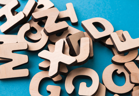 Pile of wooden english letters background, copy space. Alphabet study, abc, education conceptの写真素材