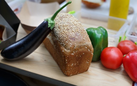 fresh bread and vegetables on sale at the local farmer market place, close-upの写真素材