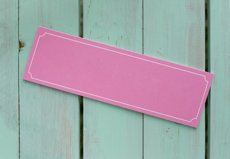 Empty place for text, wooden sign on wood background, pink on turquoise. Girly designの写真素材