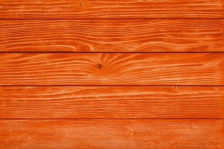 Orange wood texture and background. Painted wooden surface. Timber planksの写真素材