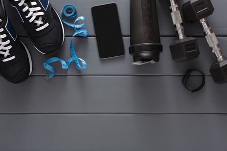 Fitness background, blue sport equipment for training, copy space, top view. Weightloss, healthy lifestyle conceptの写真素材
