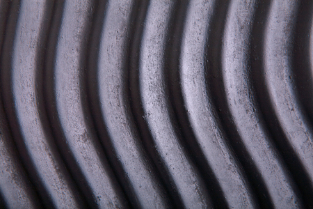 Dark wavy texture background. Black rustic surface, closeupの写真素材