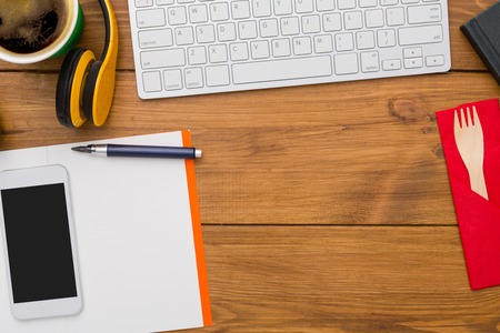 Workplace background with office supplies on wooden desk, flat lay, top view. Copy space on notebook...