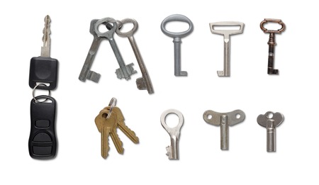 Set of different keys isolated at white background. Car, winding, old vintage and brand new keys as...