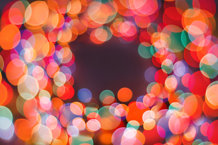 Color garland frame background, unfocused. Christmas or other holiday decorations, garland...
