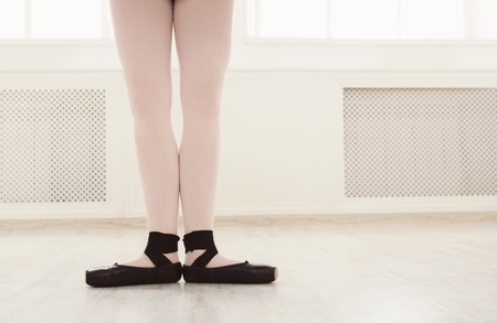 Ballerina legs first position in pointe, ballet dancer concept backgroundの写真素材