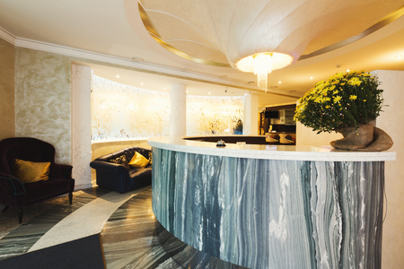 Interior of modern hotel. Luxury reception desk in contemporary style, copy spaceの写真素材