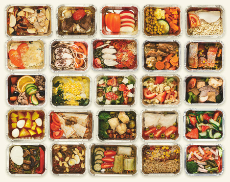Collection of take away foil boxes with healthy food. Set of containers with everyday meals - meat,...