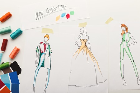 New fashion collection background. Hand drawn sketches of clothes on white board, color swatches and...