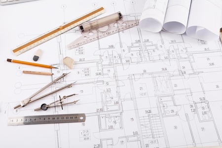Workplace of architect. Divider, pencil and ruler on blueprint, creating new architectural project...