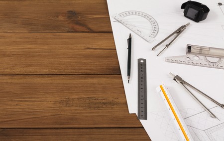 Workplace of architect. Engineering tools for creating new architectural project on wooden table, top view, copy spaceの写真素材