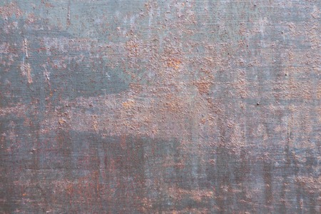 Old rusty iron background. Corrosion of weathered painted metal, copy spaceの写真素材