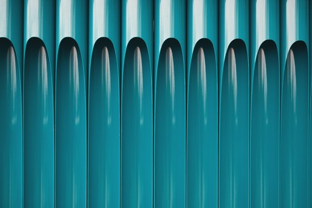 Details of blue pipes wall. Metal pipes as an element of decor, closeup, textured background, copy spaceの写真素材