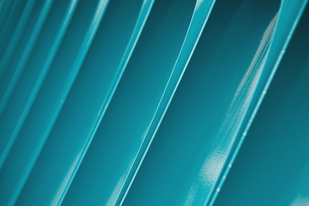 Details of blue pipes wall. Metal pipes as an element of decor, closeup, textured background, copy spaceの写真素材