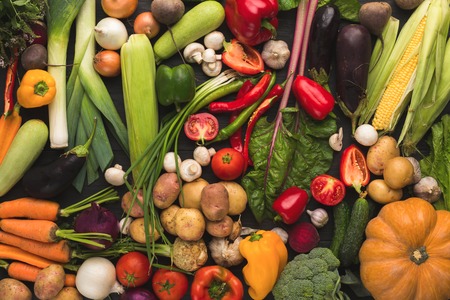 Colorful organic vegetables background. Healthy natural food on rustic table. Grocery shop...