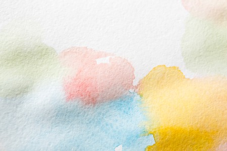 Abstract watercolor spots painted texture background. Bright colors on white for copy spaceの写真素材