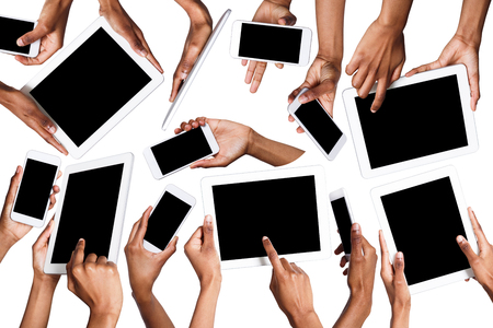 Set of black male hands touching smartphone and tablet display and pointing with index finger on blank screen, white isolated background. Communication conceptの写真素材