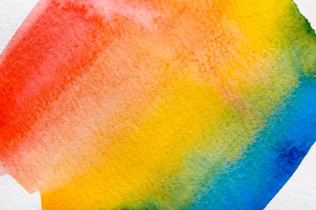 Bright watercolor rainbow. Creative abstract hand painted background on paper, texture, bright colored paintingの写真素材