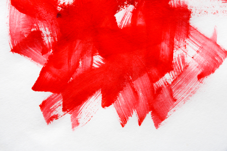 Abstract background with red oil-paints. Handpainted strokes and lines texture on white canvas, closeup, copy spaceの写真素材
