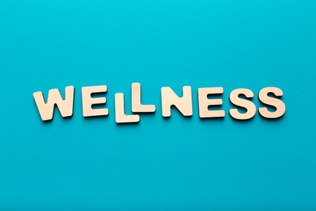 Wooden letters spelling word Wellness, top view, copy space. Healthcare conceptの写真素材