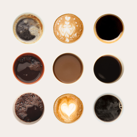 Set of coffee foams isolated on white background. Above view on different cups.の写真素材