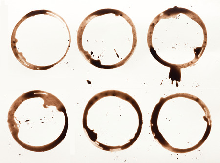 Set of coffee cup stains isolated on white background. Dry rings of bracing beverage. Collection of brown spots for grunge designの写真素材