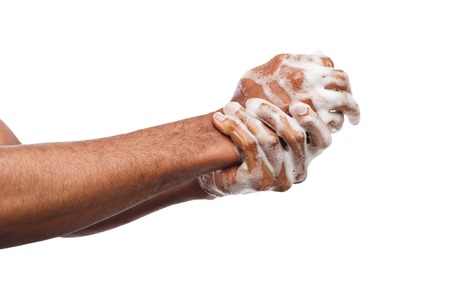 Black man washing hands with soap isolated on white background. Hygiene, cleanliness concept