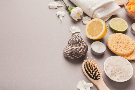 Spa background. Various cosmetology products, candles and flowers. Natural salon or home body and skin care, copy spaceの写真素材
