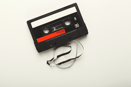 Retro audio cassette tape isolated on white background. Top view on vintage media device, copy spaceの写真素材
