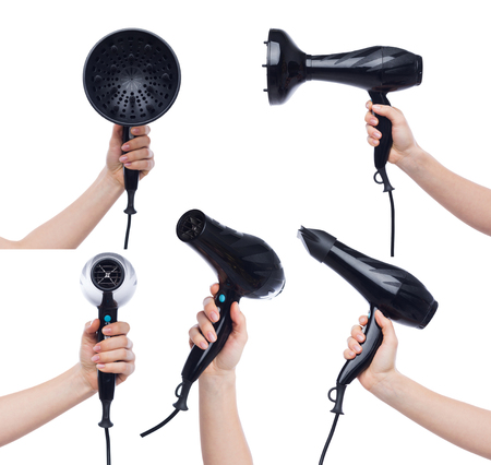 Set of woman hands holding a hair dryer isolated on white backgroundの写真素材