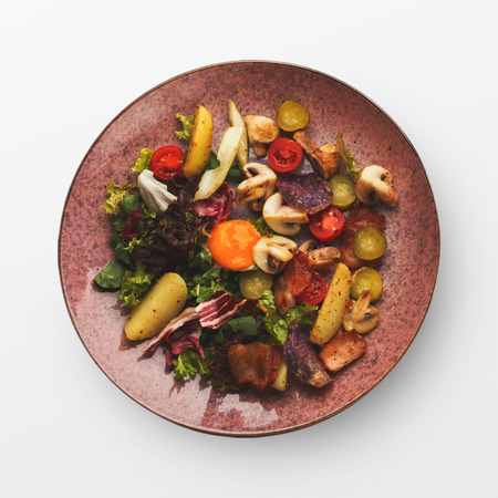 Meat stew with vegetables isolated on white. Top view on slow cooked bowl, hot autumn or winter foodの写真素材