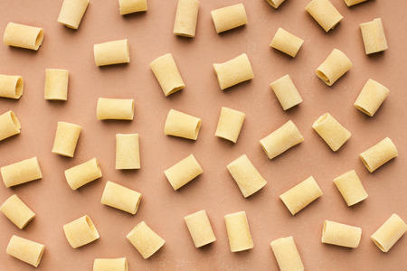 Pattern made of mezzi pasta on pink background, top viewの写真素材