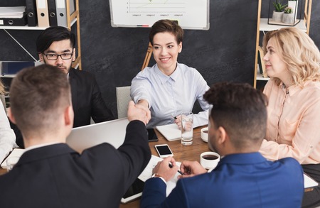 Business handshake and business people after discussing good deal of trading contract and new projects for both companies, success, partnershipの写真素材