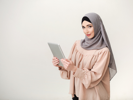 Arabian businesswoman with tablet, copy spaceの写真素材