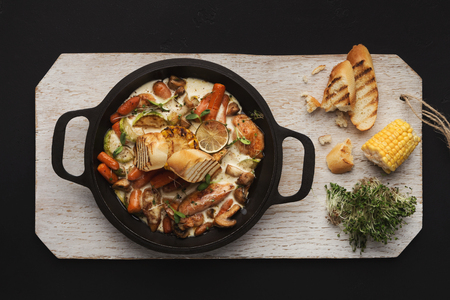 Indian spicy carry in cast iron pan. Healthy restaurant stew, top viewの写真素材