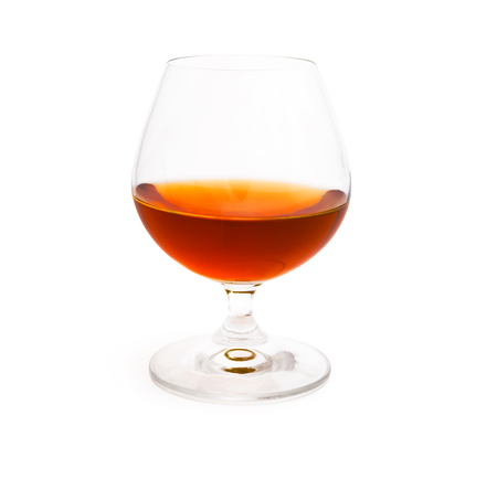 Wineglass with cognac or brandy isolated on white backgroundの写真素材