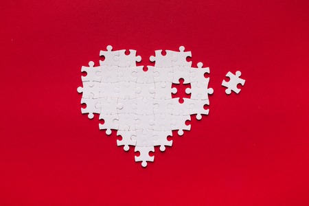 Health care concept. Puzzle heart with one piece missing. Heart vitamines addの写真素材