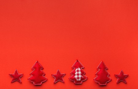 Christmas background with handmade felt decorations: xmas trees and stars. Top view, copy spaceの写真素材