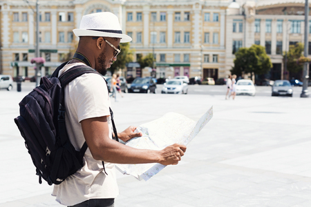 Looking for directions. Lost tourist looking at city map during trip, copy spaceの写真素材