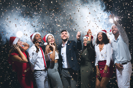 New Year party. Happy diverse people dancing and celebrating together, copy spaceの写真素材