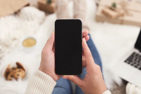 Christmas online shopping background. Smartphone screen with copy space for textの写真素材