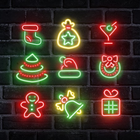 Christmas concept. Set of neon app signs over dark brick wallの写真素材